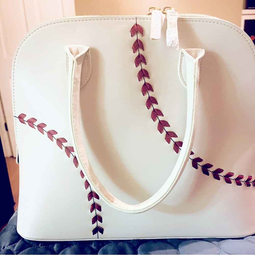 White baseball pocketbook! Brand new with red stitching. Never used. Super cute